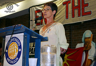 Naomi Binder Wall speaking at a podium