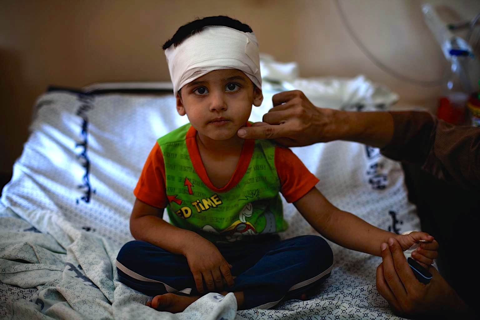 Child in Gaza wounded by Israeli bombing.